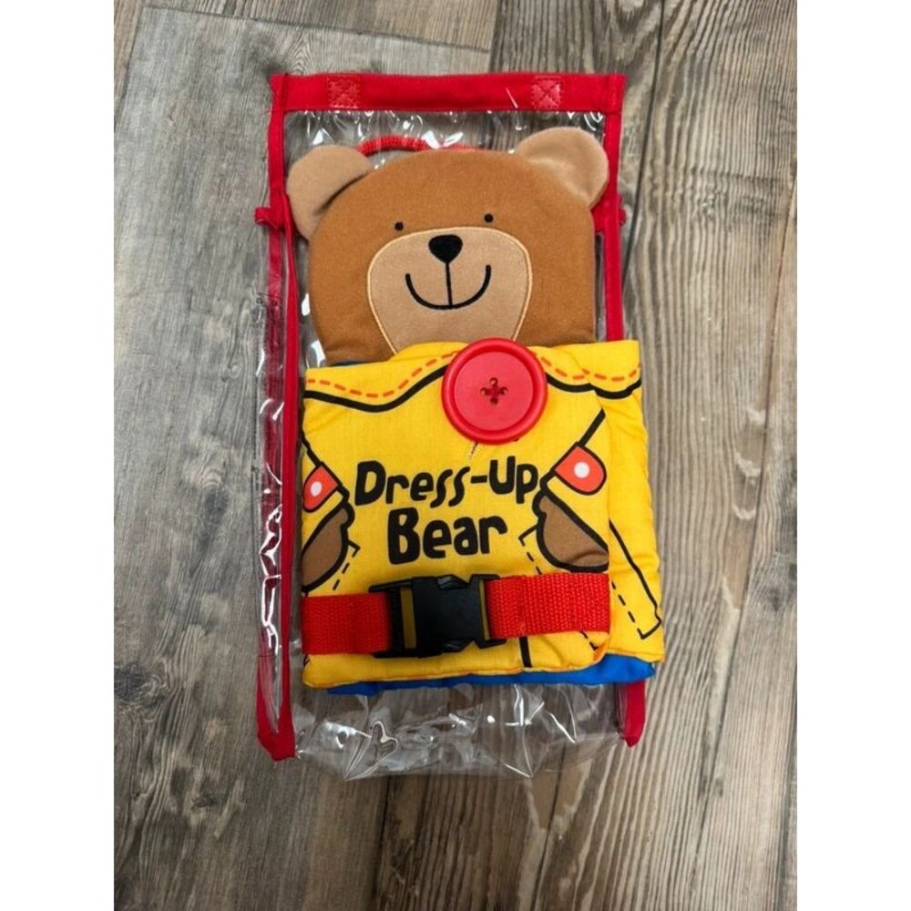 Melissa & Doug K's Kids Dress Up Bear soft activity toy.